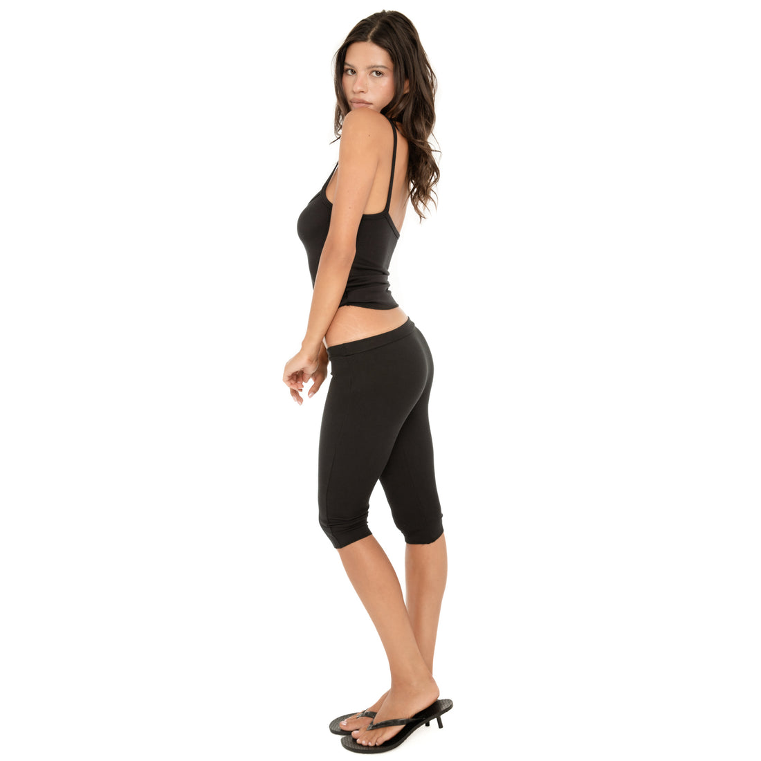 Side view of the Miia Capri in Black, showing the low-rise fit and close-fitting shape through the hip and leg **black