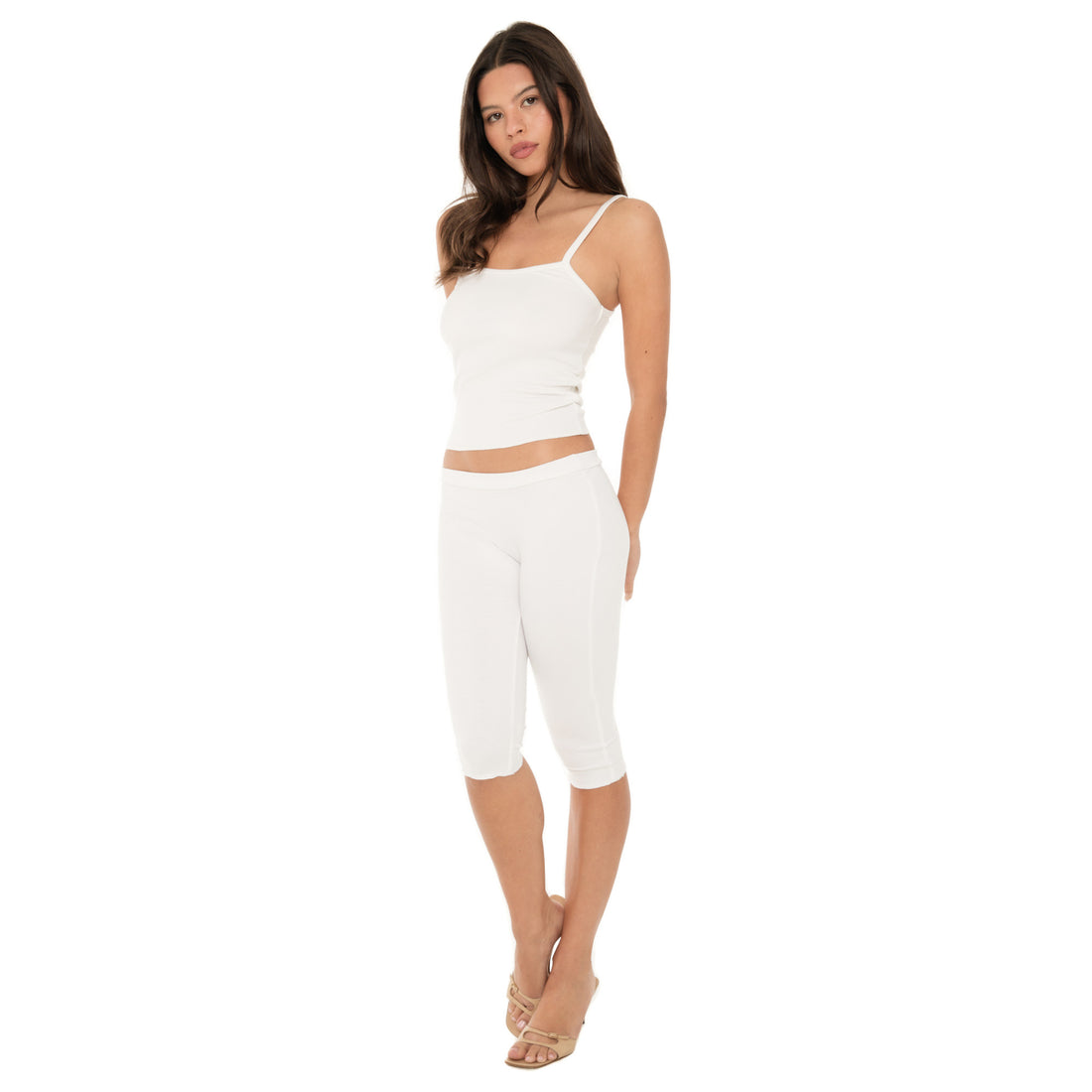 Side view of model in white low-rise Miia Capri highlighting form-fitting modal cotton fabric**white
