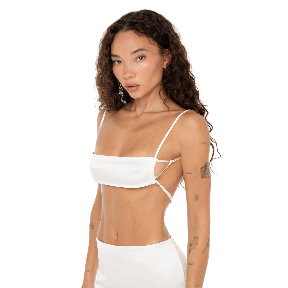 Model in Missi Bra white silk charmeuse, close-up angled view with thin adjustable straps. **white