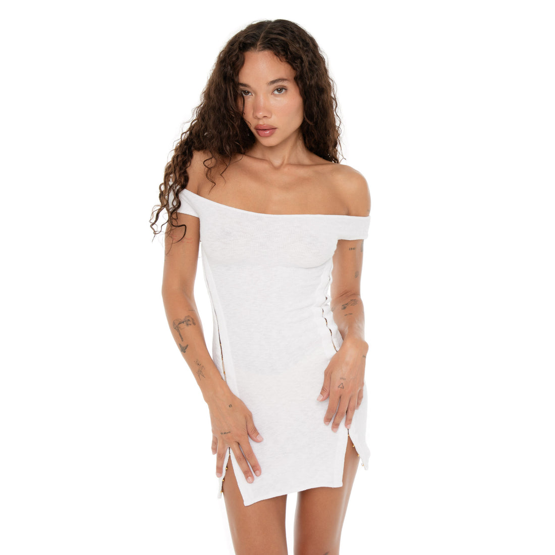 Model close-up wearing the Nikisa Dress in white, showing the contoured fit and gold hardware side accents. **white