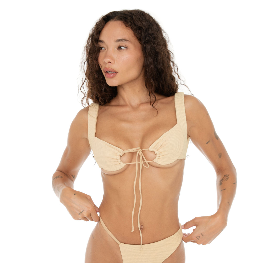 Nou Swim Top Latte – angled front view showing ruched detailing and adjustable tie front  **latte