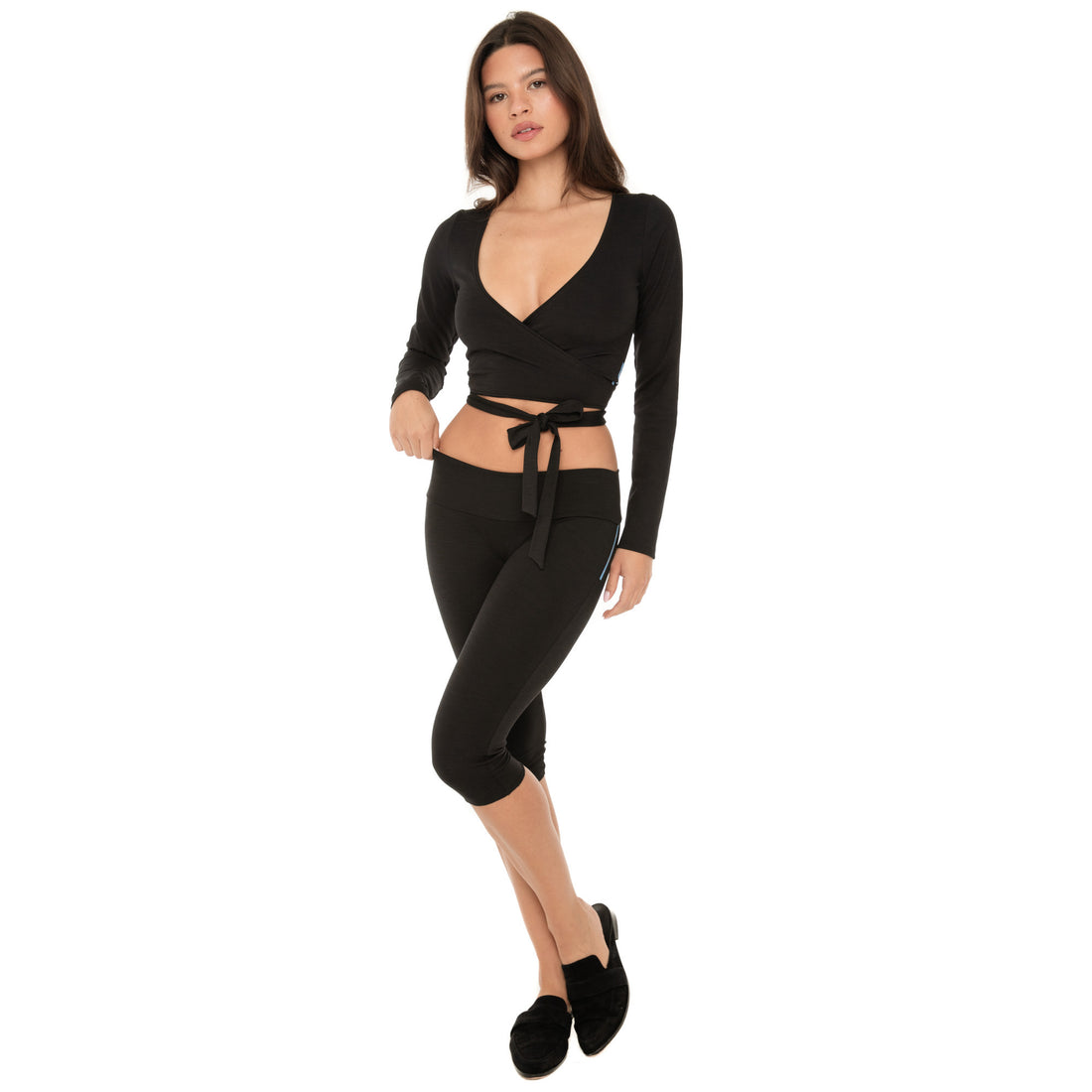 Model wearing ribbed wrap top with long sleeves and adjustable waist tie, front view **black