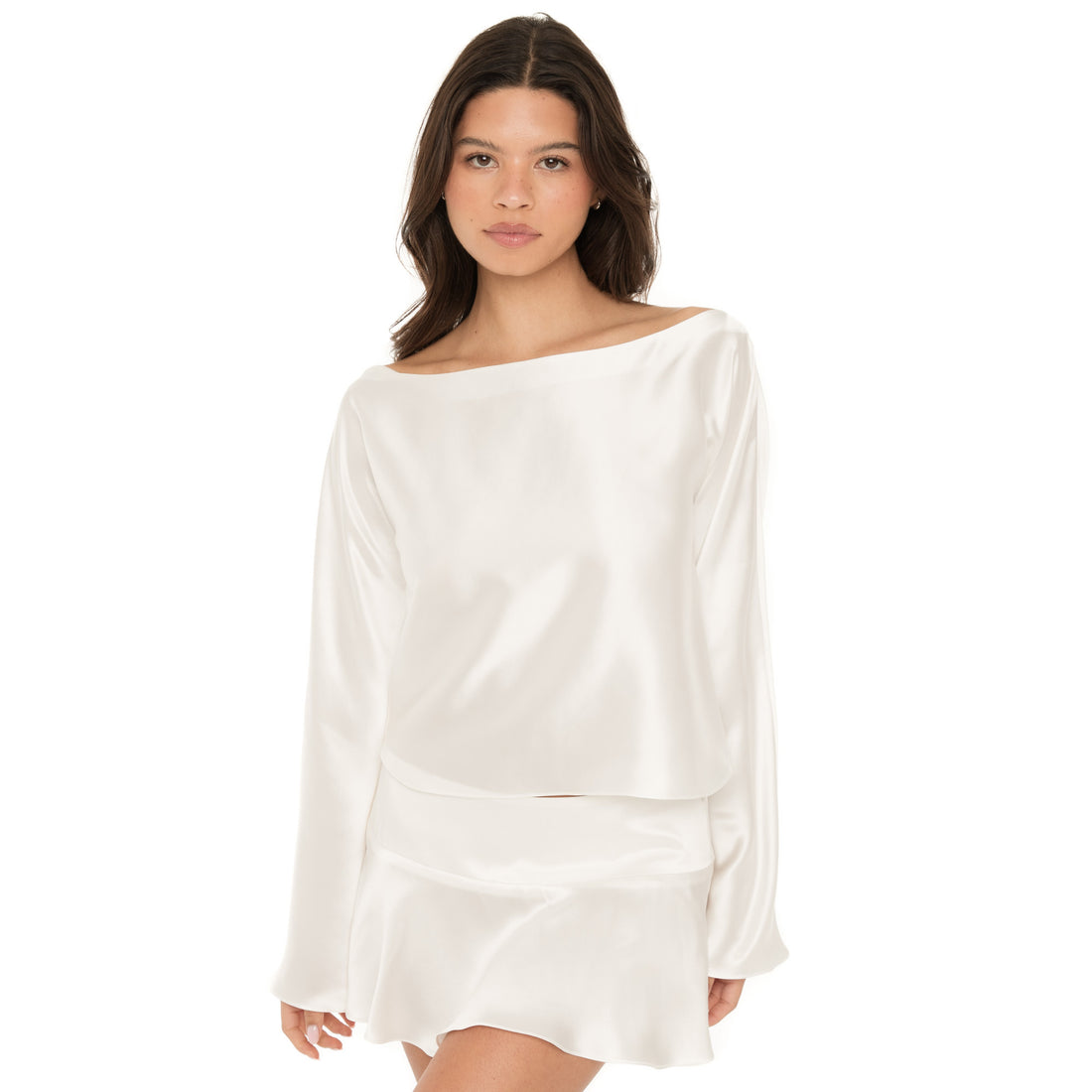 Front mid-length view of the white silk top styled with a matching skirt, highlighting the lustrous finish and drape. **white