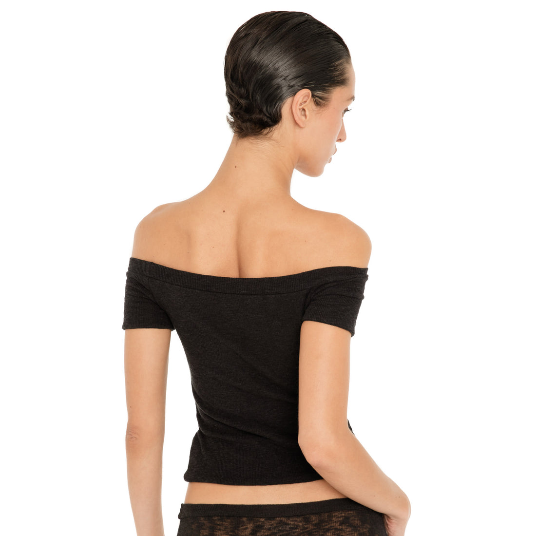 Back view of the black Solei off-the-shoulder top, showing the fitted shape and wide neckline across the shoulders **black