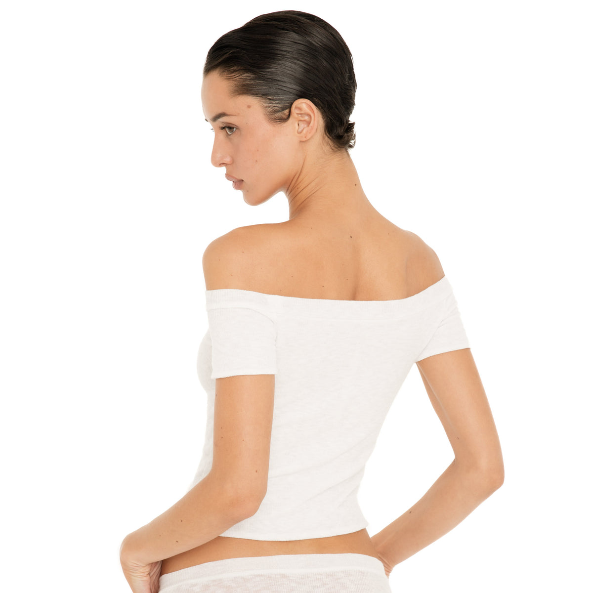 Back view of the white Solei off-the-shoulder top, showing the fitted shape and wide neckline across the shoulders **white