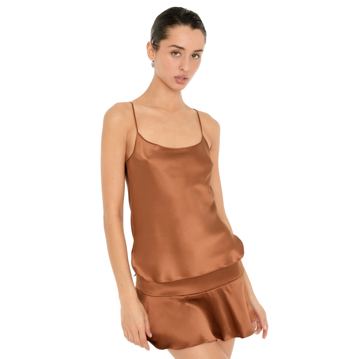 Model wearing the Copper Syra Camisole with the matching low-rise Syra Skirt. **copper