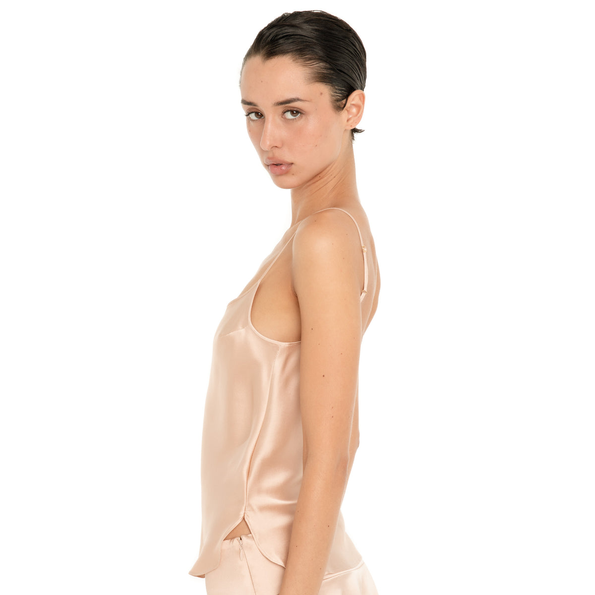 Side view of the Are You Am I Syra Camisole in Fawn, showing the adjustable spaghetti straps and curved side slit. **fawn