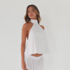 Video of model wearing white halter scarf top showing movement and drape from multiple angles **white