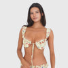 Video: Model moves and turns in the Nesi Swim Top and matching bottom in Lemon Blossom, showing the fit, ruffled details, floral print, adjustable front ties, and back of the two-piece set **lemon blossom