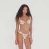 Model showcasing the Are You Am I Nesi Swim Bottom in Lemon Blossom, a ruffled bikini bottom with adjustable straps and cheeky coverage, styled with the matching Nesi Swim Top, turning to display details from all angles. **lemon blossom