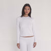 Video of model wearing the NIIMA Top in white, showcasing the stretch modal fabric and fit from all angles.**white