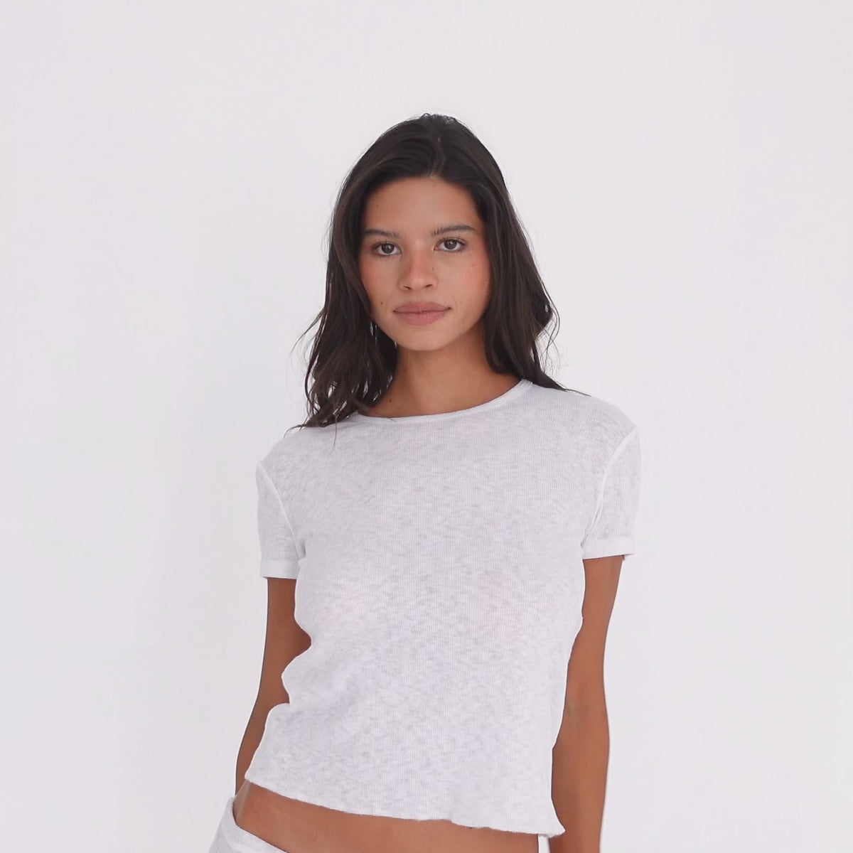 Model wearing the Kimi Tee in White with the Illi Capri, showing the relaxed cropped silhouette from multiple angles **white