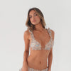Video of a model wearing the Llai Swim Top in a pastel paisley print with matching swim bottoms. The model slowly turns to show the front, sides and back of the bikini. The triangle cups feature soft ruffle trim, ruffled shoulder straps and adjustable ties at the shoulders and back, showing the fit and movement of the swim top from multiple angles. **paisley