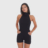 Video: Model wearing the Raili Romper in black, showing the high neck, open back, cutaway sides and fitted short silhouette in motion **black