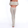 Model wearing and moving in the Liani Pant in Sky Blossom, showing the sheer floral lace, low-rise fit and fluid flared leg **sky blossom
