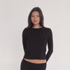 Video of model wearing the NIIMA Top in black, showing how the soft modal fabric moves and fits from multiple angles.**black