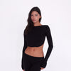 Model wearing and moving in the Quinn Top in Black, showing the fitted silhouette and open-back design from multiple angles **black