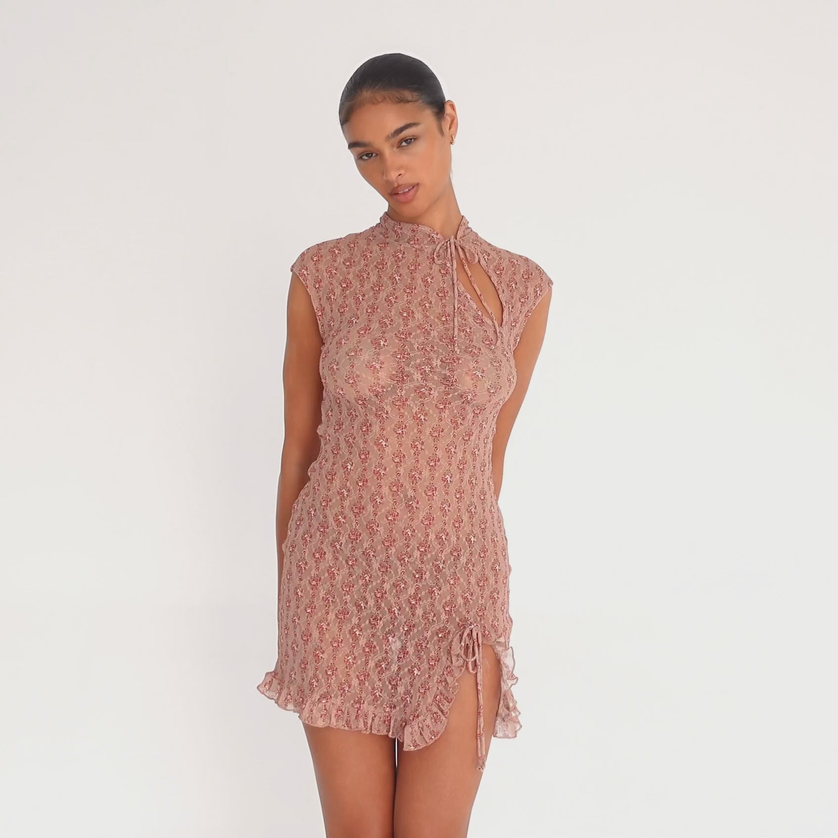 Video of Are You Am I Bibi Dress in red floral sheer lace featuring tie-neck detail, keyhole cutout, and ruffled hem. **cherry blossom
