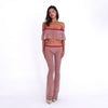 Model wearing and moving in the Liani Pant in Cherry Blossom, showing the sheer floral lace, low-rise fit and fluid flared leg **cherry blossom