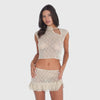 Video: Model wearing the nude Sephy Skirt and matching lace top, showing the skirt’s sheer floral lace, low rise silhouette and layered ruffle hem in motion **nude