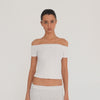 Video: Model wearing the white Solei off-the-shoulder top, showing the fit and garment details from multiple angles**white
