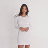 Model wearing the Nima Dress in white, long sleeve fitted mini dress in soft modal fabric, shown in motion from multiple angles. **white