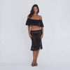 Model wearing and moving in the black Liulu Skirt with matching lace top, showing the skirt’s sheer floral lace, low-rise fit and ruffled midi hem **black