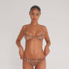 Model wearing the Iselle Bikini in blush floral lace — sheer low-rise brief with scalloped trim and stretch lace for an ultra-light fit.**leopard