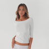360 video of off shoulder long sleeve top in motion showing stretch fit and minimal silhouette **white