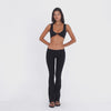 Video: Model wearing and moving in the ARE YOU AM I Senna Pant in black, featuring a low-rise waistband and flared leg **black