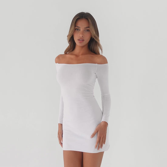 Model wearing a white off shoulder long sleeve mini dress, slowly shifting poses to show the fit from multiple angles, highlighting the stretch fabric, neckline, and body contouring silhouette **white