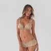 The Llai Swim Bottoms in Latte feature a flattering low-rise boyshort silhouette with a comfortable smocked elastic waistband, adjustable front drawstring and soft ruffle trim. Designed to pair perfectly with the matching bikini top, the feminine silhouette moves effortlessly while showcasing the fit and details from every angle. **latte