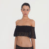 video: Model wearing the Liulu Top in black, showing the movement, sheer floral lace and off shoulder ruffle silhouette from multiple angles **black