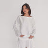 Model wearing the Liis Top in white silk charmeuse, shown from front, side, and back to display the drape, sheen, and movement of the fabric. **white