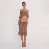 Model wearing the liulu leopard skirt, showing the sheer low-rise midi silhouette, lace trim and ruffled hem from multiple angles.