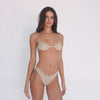 Model wearing the Iselle Bikini in nude — vintage-inspired sheer lace bikini with high-cut legs, soft stretch, and subtle floral mesh texture**nude