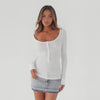 ivory waffle knit long sleeve top in motion, showcasing scoop neckline, button placket, and fitted stretch silhouette