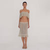Video: Model wearing the Liulu skirt, a sheer cream floral lace midi skirt with a low-rise waist, lace trim, and ruffled hem, styled with the matching off-the-shoulder top. **sky blossom
