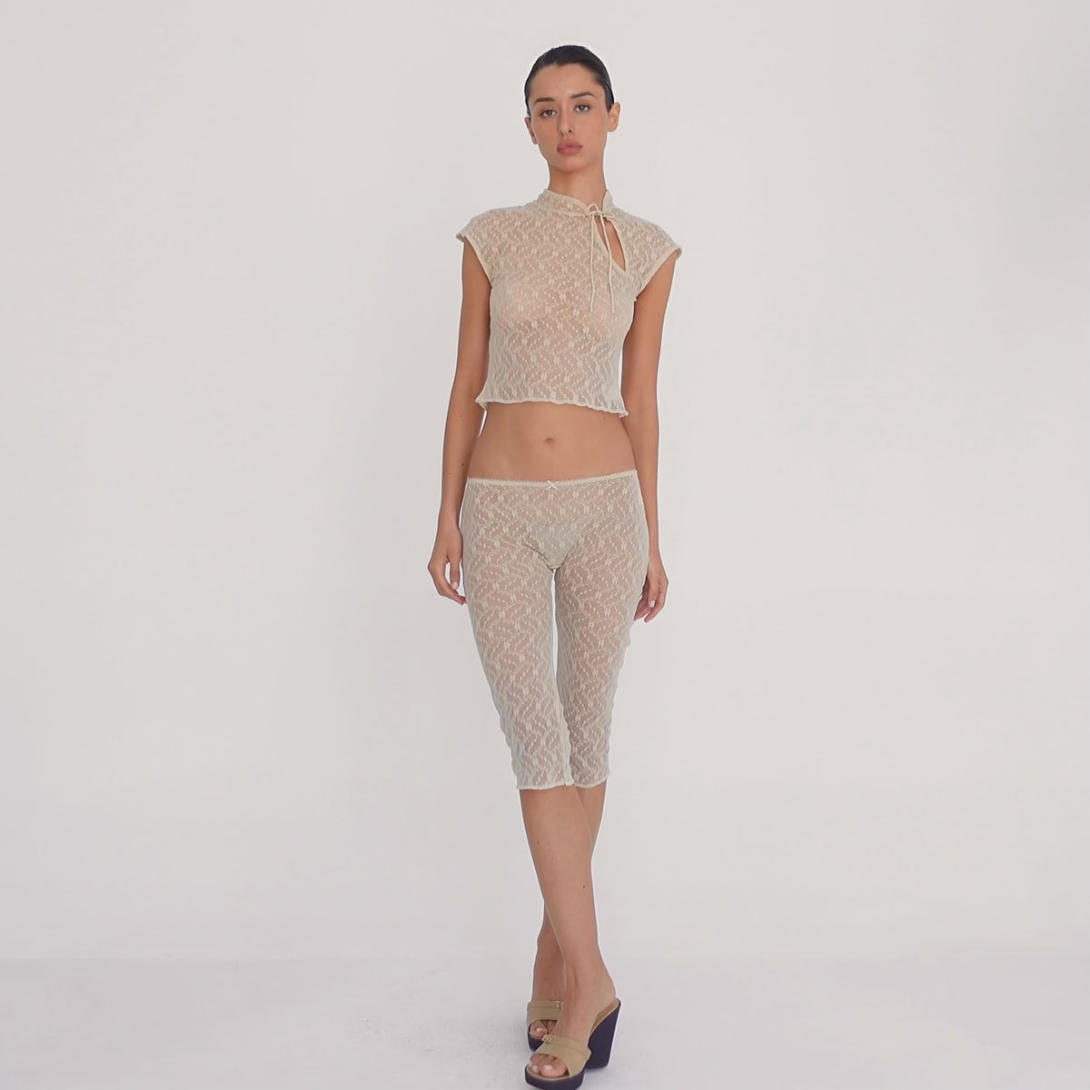 Model wearing the nude sheer floral lace Lyli Capri and matching cropped lace top, shown from multiple angles to demonstrate the fit, length, sheerness, and movement of the lace. **nude