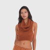 Video: Model wearing the Ponette Top in sienna, showing the soft knit texture, oversized draped cowl neck and cropped sleeveless silhouette in motion **sienna