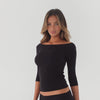 360 video of off shoulder long sleeve top in motion showing stretch fit and minimal silhouette **black