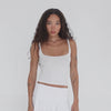 Video of Are You Am I Elix Tank in white, minimal raw-edge cotton stretch tank top. **white
