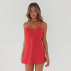  mini slip dress on model in motion, featuring thin straps, a fluid drape, and a soft, glossy finish as the fabric moves naturally in a clean studio setting **cherry red
